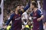 Ivan Rakitic (th.) og Lionel Messi (tv.) jubler over kroatens scoring lørdag på Bernabeu, som sikrede Barcelona en 1-0-sejr i El Clasico.