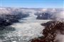 Nasa-foto fra maj 2017 af en fjord i det sydlige Grønland, hvor regn bliver mere og mere almindeligt, hvilket får isen til at smelte stadigt hurtigere. Forskere bag ny rapport siger ifølge BBC, at de er "overraskede" over, at det regner selv i den lange arktiske vinter.