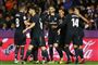 Real Madrid-spillerne jubler, efter at Karim Benzema (i midten) har bragt holdet foran 2-1.