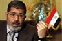 Egyptens tidligere præsident Mohamed Mursi er død, efter at han mandag kollapsede under et retsmøde. Mohamed Mursi var en førende figur inden for det islamistiske Muslimske Broderskab. (Arkivfoto).