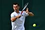 Bernard Tomic vil appellere den bøde, som han er blevet idømt efter at have tabt sin kamp ved Wimbledon på under en time. (Arkivfoto)