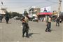 Afghanske politifolk på gaden kort efter, at et bombeangreb onsdag rystede Kabul. Mindst 14 er dræbt, og 145 såret.