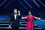 Skuespiller Rasmus Bjerg og filminstruktør Hella Joof guidede lørdag aften seerne igennem Dansk Melodi Grand Prix i Royal Arena i København.