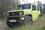 En Jimny i en skov