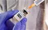 en beholder med corona-.vaccine 