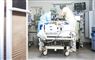 sundhedspersonale ved seng på hospitel