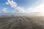mindre sandstorm på strand på Rømø