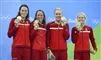 Mie Ø. Nielsen, Rikke Møller Pedersen, Jeanette Ottesen og Pernille Blume viser deres bronzemedaljer frem.