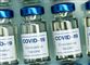 flasker med vaccine på række