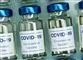 flasker med vaccine på række