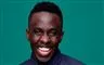 komikeren melvin kakooza smiler stort 