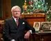 sveriges kong Carl Gustaf sidder i jakkesæt og slips