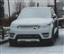 En Range Rover tildækket af sne