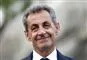 frankrigs tidligere præsident Nicolas Sarkozy smiler 