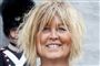 En blond smilende kvinde