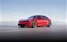 En rød Tesla på en vej