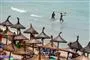 Strand og badende i vandet