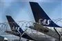 sas-fly står på jorden