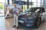 Uwe Holmsgaard står ved sin nye Mustang
