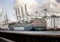 Et kæmpe containerskib i en havn