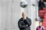 en træner på et stadion