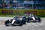 Racebiler i overhaling