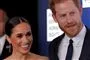 Meghan Markle med et stort smil og Harry ved sin side