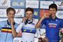 Tre cykelryttere med medaljer