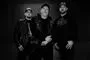 Michael Poulsen, sanger Marc Grewe og trommeslager Morten Toft Hansen i sort hvid