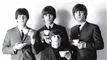 et sort-hvd billede af The Beatles