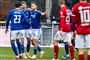 fodboldspillere i aktion