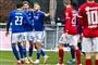 fodboldspillere i aktion