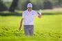 Golfspiller vinker