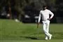 en mørk golfspiller