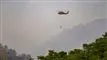 helikopter slukker brand