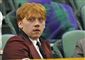 portræt af rubert grint som tilskuer ved en tennisbane