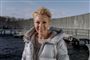 Smilende Lene Beier i vinterjakke og med sol i ansigtet