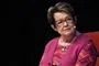Ghita siddende i en stol i interviewsituation