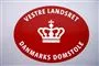 emblem med teksten vestre landsret hænger på væg