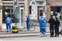 politi og teknikere til stede ved neglesalon
