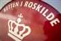 rødt skilt med ordene Retten i Roskilde