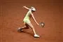 kvindelig tennisspiller på rødt grus