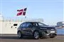 en Audi ved et krigsskib