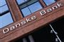Facaden på en rød bygning, hvor der står Danske Bank