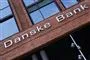 Facaden på en rød bygning, hvor der står Danske Bank