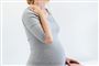 Torsoen af en gravid kvinde