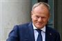 Donald Tusk i blå jakke og slips