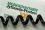 Telefonledning henover forside af avis