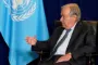 Guterres sidder med højre side til kameraet og taler med person uden for billedet