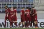 fodboldspillere jubler efter scoring